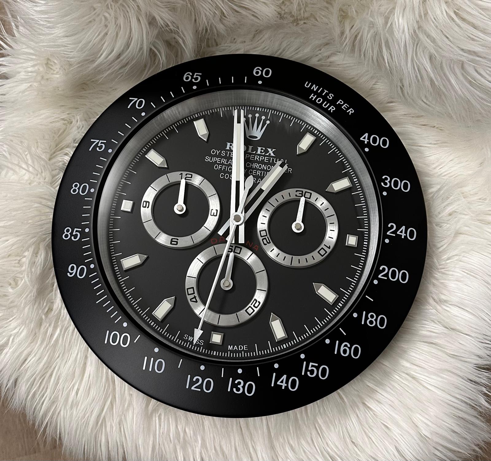 ROLEX DAYTONA STYLE DEALER WALL CLOCK (BLACK DIAL WITH SILVER-TONED MARKINGS)